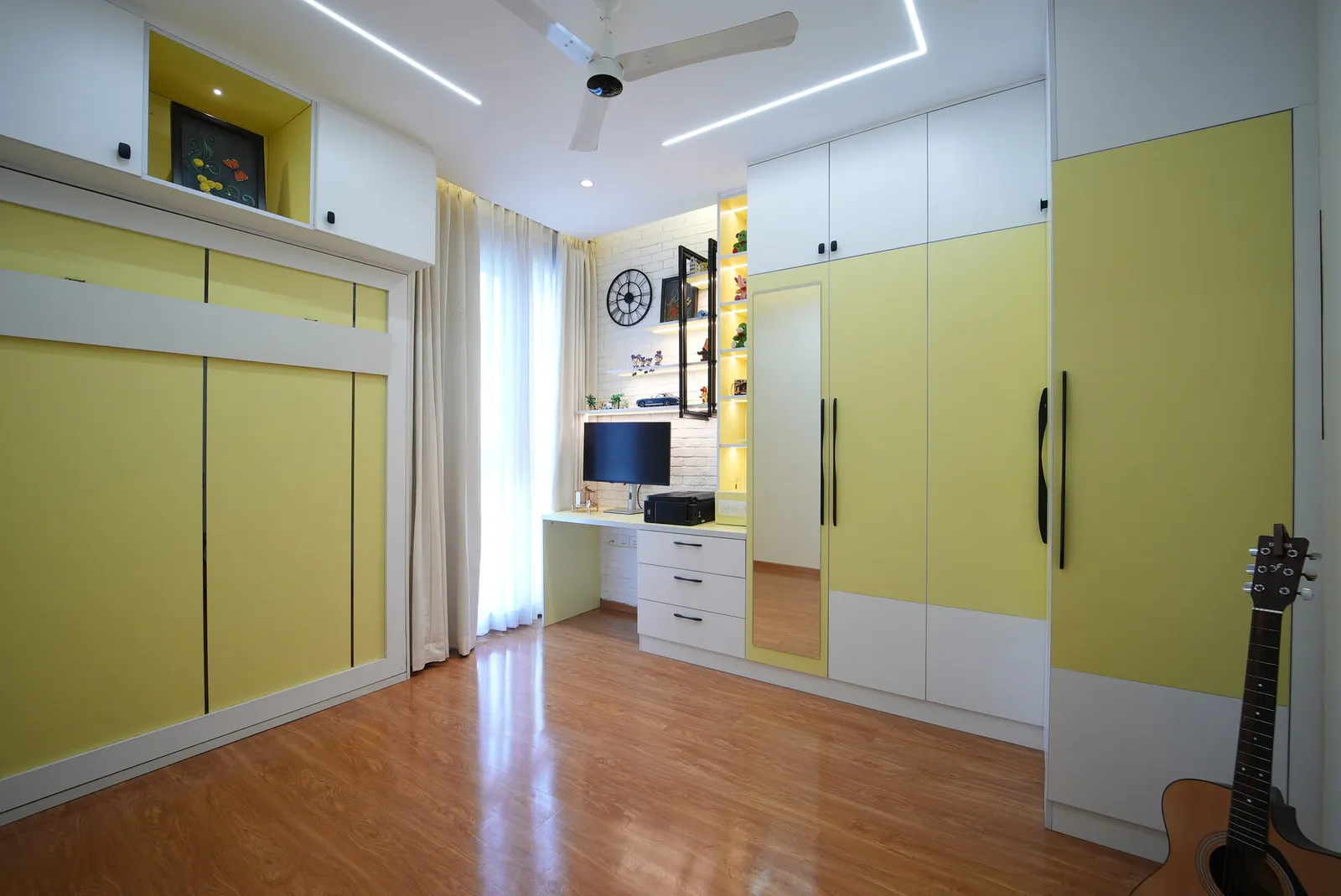 Signature tier kids bedroom with yellow wardrobe and study desk, Bangalore