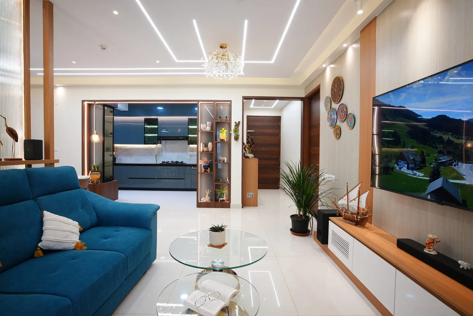 Signature tier living room with TV feature wall and blue sofa, Bangalore