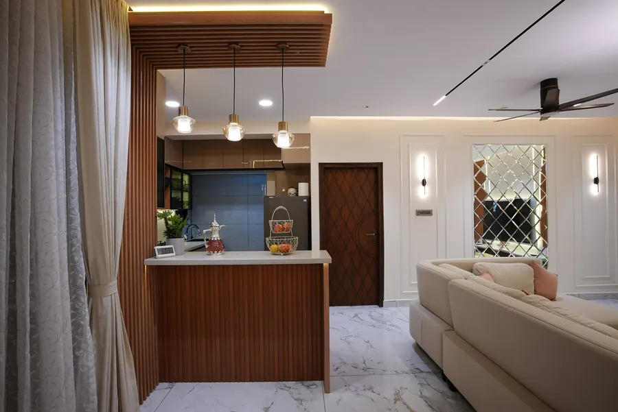 Breakfast counter beside the kitchen in a Jayanagar home designed by Skyline Spaces